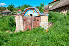 Ancient Cellar For Storing Wine , Exterior View . Old Rural Cellar With Wooden Door 