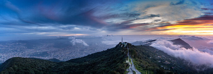 Wall Mural - Aerial panoramic view of Caracas city at sunrise from Hotel Humboldt. Caracas Venezuela.