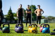 Kettlebell weightlifting. Group training after a lockdown outside the city. Get in shape