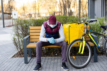 Young delivery man with yellow backpack takeaway concept