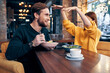 © SHOTPRIME STUDIO - cheerful young couple in a restaurant having a snack rest lifestyle