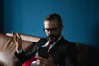 © Me studio - business man video call on mobile phone