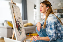 Creative Beautiful Woman Painting At Home. Coronavirus Quarantine, Isolation.