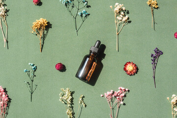 top view of face serum on green