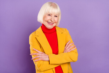 Poster - Photo of optimistic pretty short hairdo mature lady crossed arms wear yellow jacket isolated on purple color background