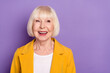 Photo of aged cheerful person toothy smile look interested empty space isolated on violet color background
