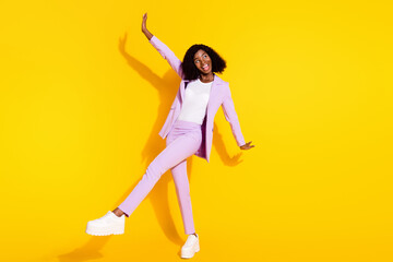 Full size photo of young happy smiling funky funny afro woman dancing enjoy weekend isolated on yellow color background