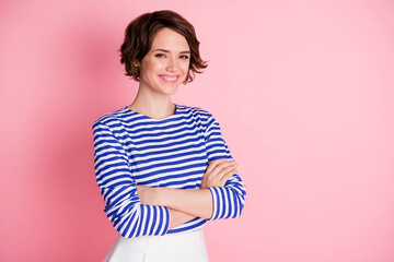 Sticker - Photo of young beautiful smiling cheerful positive girl with folded arms look camera isolated on pink color background