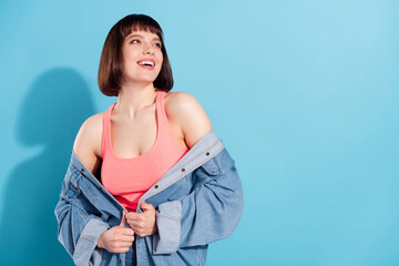 Poster - Portrait of attractive cheerful dreamy girl fantasizing copy space isolated over bright blue color background