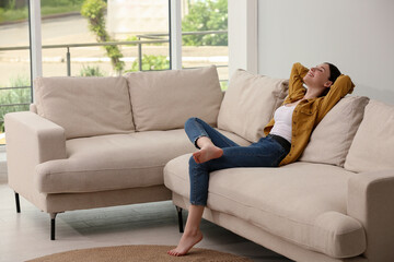 Poster - Teenage girl relaxing on sofa at home