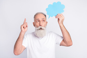 Sticker - Photo of smart happy dreamy old man look empty space point finger up idea hold clod isolated on grey color background