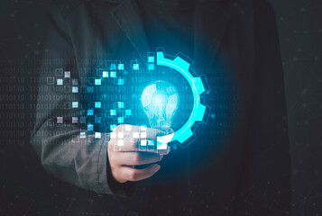 Wall Mural - digital transformation concept. hand holding light bulb modern interface futuristic blue gear digita