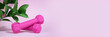 © Syrtseva Tatiana - Pink dumbbells are isolated on a pink background with hard shadows and leaves. The concept of fitness, home workouts, activity and sports, healthy lifestyle. Women Health. Banner. Copy space