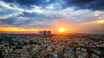 Sunset in Bangalore City India with blue, orange and yellow clouds