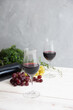 © Cyrena111 - red wine and grapes on white wooden table