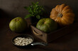 Still life with orange and green pumpkins and pumpkin seeds on rustic background.