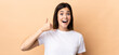 © luismolinero - Teenager Brazilian girl over isolated background making phone gesture. Call me back sign