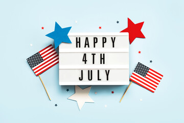 Happy Independence day July 4th.Lightbox with the text Happy July 4th,american flags and stars