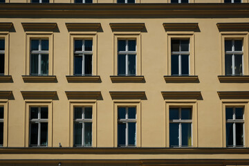 Canvas Print - windows on old residential building facade, real estate exterior -