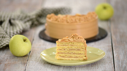 Wall Mural - Piece of apple layer cake with caramel cream.