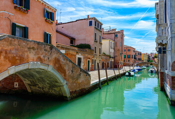 Wall Mural - Narrow canal with bridge in Venice, Italy. Architecture and landmark of Venice. Cozy cityscape of Venice.