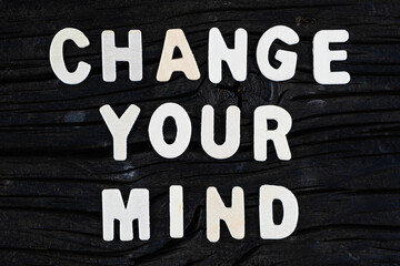 Wall Mural - Change Your Mind words on dark wooden background. Business, motivational and inspirational concept.