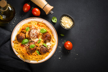 Sticker - Pasta with Meatballs in tomato sauce, basil and parmesan on dark stone table. Top view with copy space.