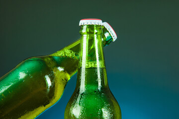 green beer bottle cheer  on blue background