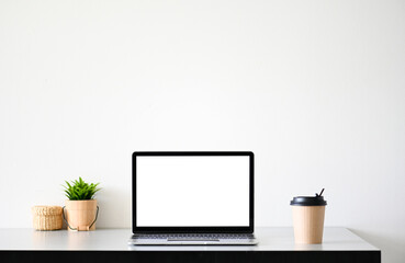 Wall Mural - Laptop computer with blank screen in office