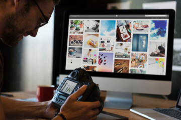 Man viewing photos on his camera