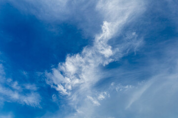 Wall Mural - wispy clouds and blue sky suitable for background