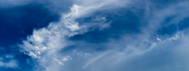 Wall Mural - wispy clouds and blue sky suitable for background