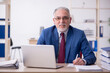 © Elnur - Old male employee and too much work in the office