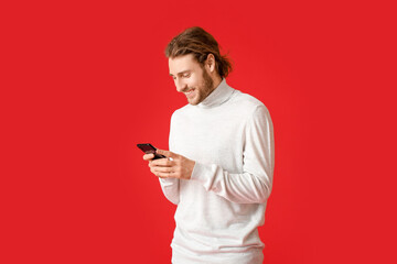 Sticker - Young man using mobile phone on color background