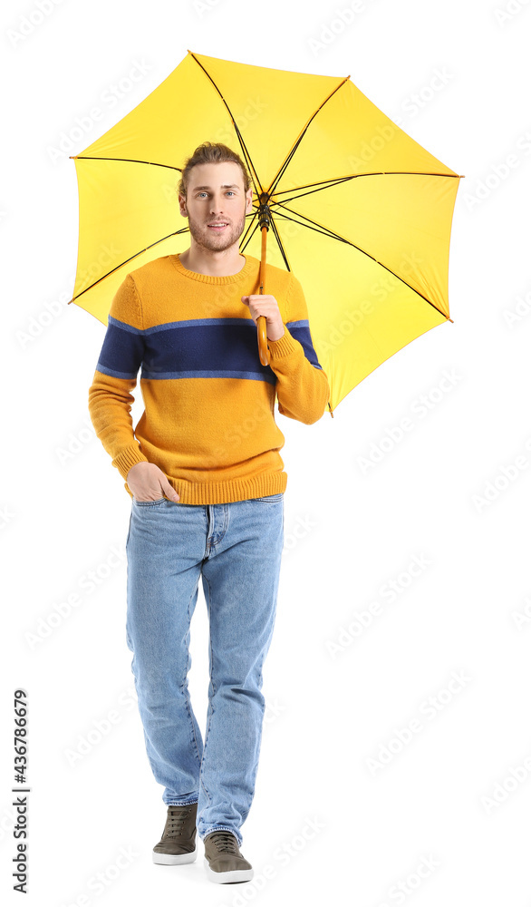 Handsome young man with umbrella on white background
