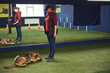 © Svitlana - Handler using a hand signal during the obedience training