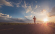 © sutadimages - Athlete runner feet running on road, Jogging concept at outdoors. Man running for exercise.