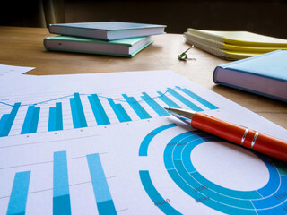 Wall Mural - Business statistics and data analysis. Papers with financial results on the table.