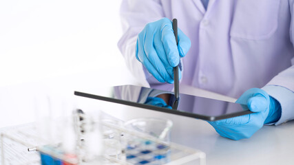 Team of Medical Research Scientists or researcher in lab coat testing their experimental in Modern laboratory.