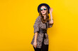 © deagreez - Photo of glamour happy charming lady look empty space wear sunglass isolated on yellow color background