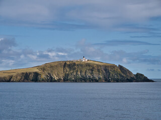 A view of Sumburgh Head at the south of the Shetland, UK, taken from the Ness of Burgi on a calm, sunny day in Spring.