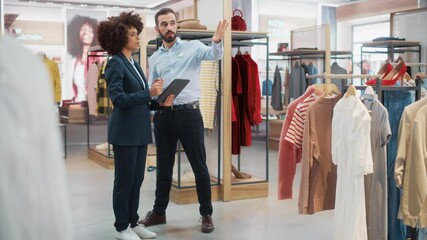 Wall Mural - Clothing Store: Businesswoman Uses Tablet Computer, Talks to Visual Merchandising Specialist, Collaborate To Create Stylish Collection. Small Business Fashion Shop Sales Manager Talks to Designer.