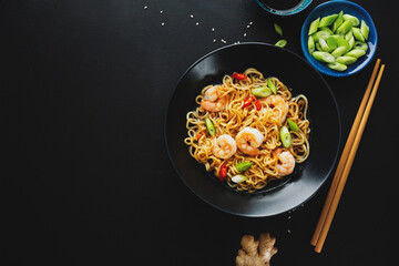 Wall Mural - Asian noodles on plate on dark background