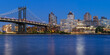 Brooklyn waterfront next to the Manhattan Bridge (DUMBO neighborhood - Main Street Park) at twilight with the East River. New York City