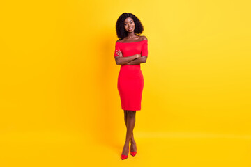 Wall Mural - Full size photo of young happy positive gorgeous stunning afro girl with folded hands isolated on yellow color background