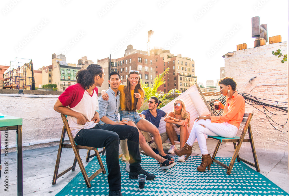 Group of friends having party on a rooftop - obrazy, fototapety, plakaty 