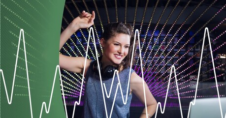 Composition of green curve and white sound peak meter over smiling female dj and colourful lights