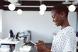 © Wavebreak Media - Smiling african american businesswoman using tablet at work