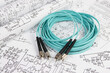 © bayurov - Fiber optic patch cord cable on electrical engineering drawings