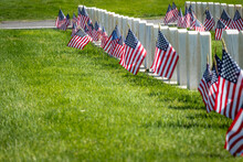 Military Headstones And Gravestones Decorated With Flags For Memorial Day